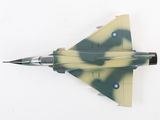 a model of a fighter jet on a white surface