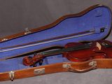 a violin in a case with a bow in it