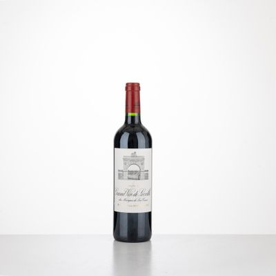 a bottle of red wine sitting on top of a table