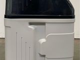 an image of a black and white toaster sitting on the floor