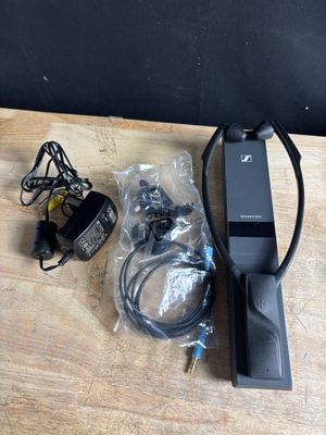 a remote control sitting on top of a wooden table