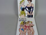 deux livres posés sur une table blanche, avec la photo d'une femme en maillot de bain