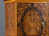 a wooden cabinet with a clock on top of it