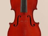 an old violin with a bow hanging from it ' s back