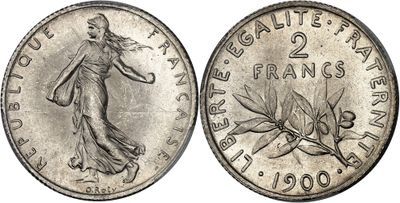 a silver coin with the image of a woman on it