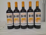 six bottles of wine are lined up on a table