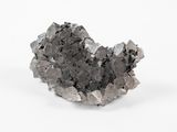 une image représentant un morceau de roche posé sur une surface blanche