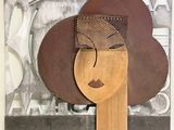 tableau représentant le visage d'une femme, devant lequel se trouve une cuillère en bois