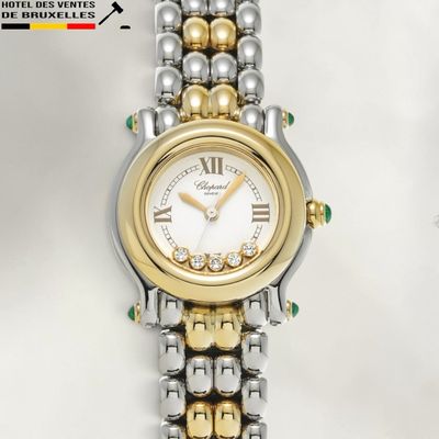an image of a close up of a wrist watch on a white surface