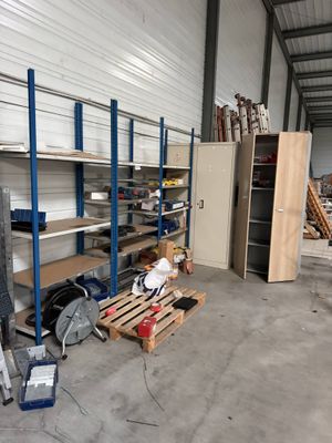 a room with a lot of shelves and shelves in it
