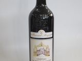 a bottle of wine that is sitting on a table