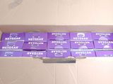 a cardboard box filled with a lot of purple boxes