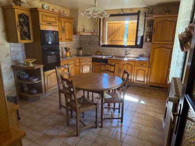 a kitchen with a table and chairs in it