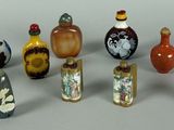 a lot of glass bottles that are sitting on a table