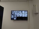 a flat screen tv mounted on the wall in a room