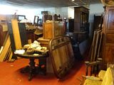 a room filled with lots of furniture and a clock
