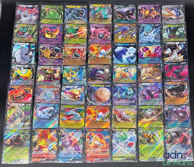 a large collection of pokemon cards are displayed on a table