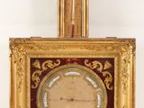 a clock that is hanging on the wall in the room