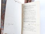 someone is holding a book open to a page with a picture on it