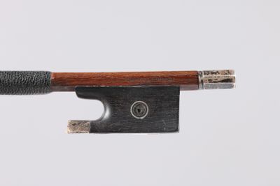 a close up of a violin bow on a white background