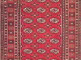 a red and black rug with a pattern on it