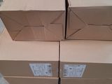 boxes stacked on top of each other on a pallet in a warehouse