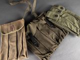 two pieces of military clothing sitting on top of a table