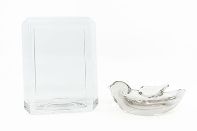 a small glass vase and a small glass container