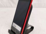a cell phone that is sitting on a stand