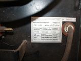 a label on the back of a machine that is sitting on a table