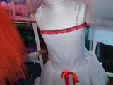 a mannequin in a dress on a chair in a room
