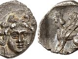 une pièce d'argent sur laquelle figurent un homme et une femme