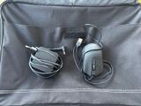a piece of luggage that has a mouse and headphones in it