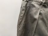 a close up of a man ' s pants with a cell phone in his pocket