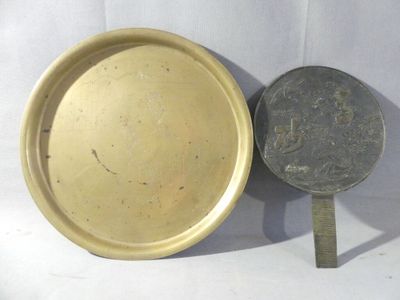 a gold plate and a silver plate next to each other