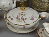a table with a lot of plates and cups and saucers