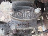 a close up of a motorcycle engine with rust on it
