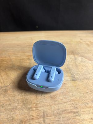 a close up of a pair of blue ear buds in a blue case