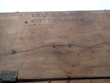 a wooden box that has a sign on it
