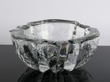 a glass bowl that is sitting on a table