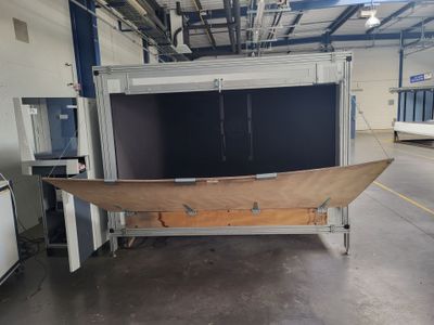 an image of a large boat in a warehouse