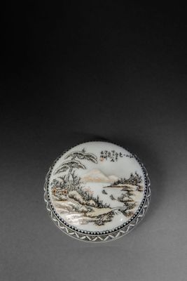 a white and black plate sitting on top of a table