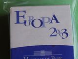 an image of a package of cigarettes sitting on top of a green table