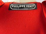 red jacket with a black label on it that says philippe venet paris new york