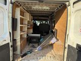 a white van with a flat screen tv in the back of it