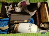 a suitcase that is open on a bed with other items