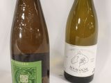 three bottles of wine sitting next to each other on a table