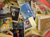 many books that are in a box on the table