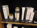 many different types of skin care products displayed on a shelf