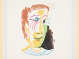 painting of a man ' s face in a wooden frame on a white background